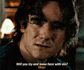 a close up of a man 's face with the words " will you try and leave here with me okay "
