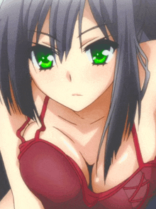 a girl with green eyes is wearing a red top