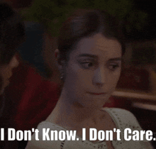 a woman says " i don 't know i don 't care " with her eyes closed