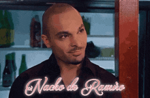 a man in a black shirt with nacho de ramiro written above him