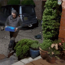 Delivering A Package Robert E Fuller GIF - Delivering A Package Robert E Fuller Bringing A Package GIFs