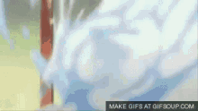 a gif of a man holding a sword with the words make gifs at gifsoup