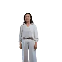 a woman in a white shirt and white pants is dancing in front of a white background