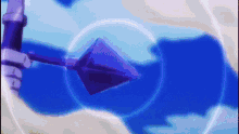 a purple arrow is flying through a blue circle in the sky .
