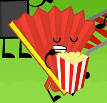 a red fan is holding a box of popcorn