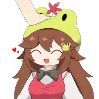 a girl wearing a frog hat with a flower on top