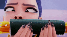 a woman with long black nails is holding a roll of sushi in front of her face