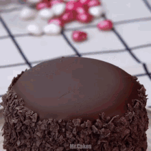 a close up of a chocolate cake with the words mr.cakes written below it