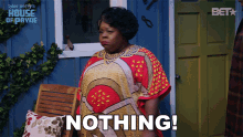 a woman says nothing in front of a house of payne logo