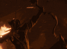 a statue of a dragon is surrounded by fire
