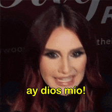 a close up of a woman 's face with ay dios mio written in yellow