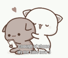 two cartoon cats are hugging each other and one is holding a phone .