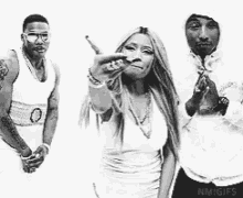 a black and white photo of a man , a woman , and a man standing next to each other .