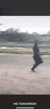 a blurry picture of a person running on a road with the words me tomorrow below them