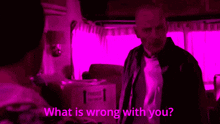 a man is talking to another man with the words " what is wrong with you " behind him