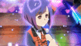 a girl with blue hair holds a microphone in her hand