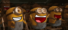 a group of minions are laughing and smiling with their mouths open
