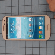 a samsung phone with the time of 5:59 on the screen