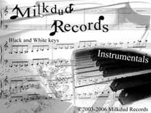 an ad for milkdud records shows a piano keyboard