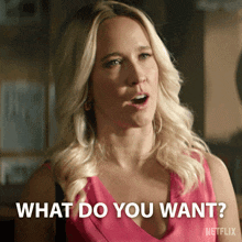 a blonde woman in a pink dress says what do you want