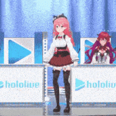a girl in a red dress is standing in front of a sign that says hololive production .