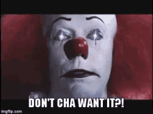 a close up of a clown with a red nose and the words `` do n't cha want it '' .