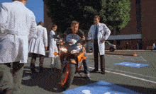 a man sitting on a motorcycle in a handicapped parking space