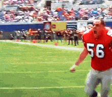 a football player in a red jersey with the number 56 on it