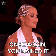 a woman sitting in front of a microphone with the words once again you nailed it above her
