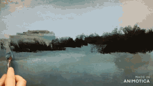 a person is painting a landscape with the words made in animotica below it