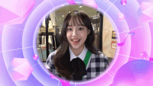a girl in a plaid shirt is smiling in a circle with purple bubbles