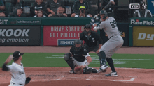 a baseball player with the number 99 on his jersey swings at the ball