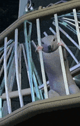 a statue of a bear behind a fence with a blurred background