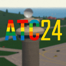 a rainbow colored sign that says atc24
