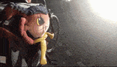 a stuffed animal wearing sunglasses and a yellow scarf is sitting next to a bicycle