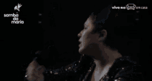 a woman is dancing on a stage with the words samba da maria on the bottom