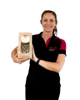 a woman is holding a bag of food that says ' penny sponge ' on it