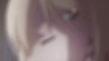 a close up of a person 's face with a blurry background