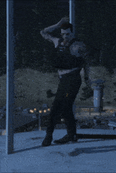 a man wearing a vest that says police is standing on a roof