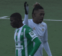 two soccer players one of whom has the number 8 on his back