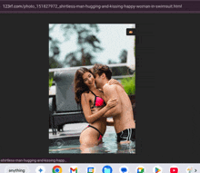 a man and a woman are hugging and kissing in a pool