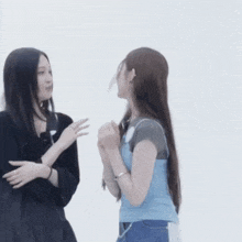 two women are standing next to each other with a question mark on their heads