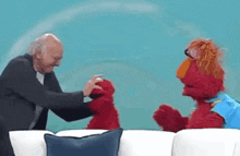 Elmo Attack Larry David GIF - Elmo Attack Larry David Larry David Elmo GIFs