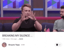 a man is sitting on a couch with his hands on his face and the words breaking my silence