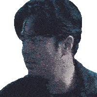 a close up of a man 's face with a black shirt on