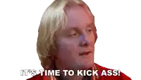 a man in a red shirt is saying it 's time to kick ass