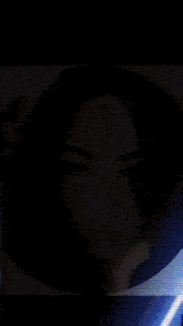 a woman with curly hair is in a circle