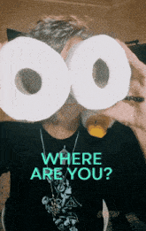 a person holding two rolls of toilet paper in front of their eyes with the words where are you on the bottom right