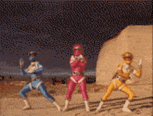a group of power rangers are standing in the desert