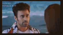 a man and a woman are looking at each other and making funny faces .
